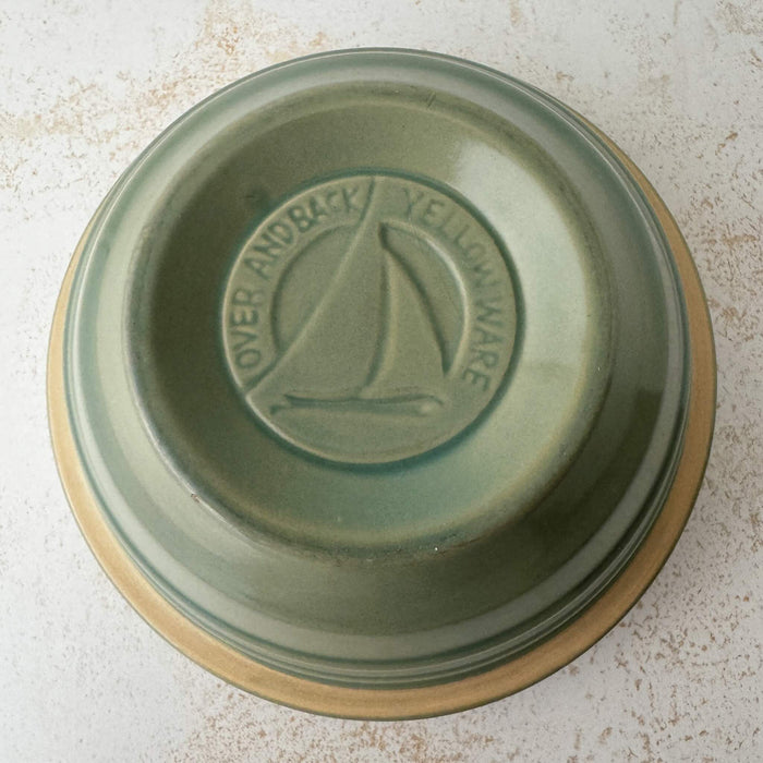 Bottom and underside of green Over and Back yellowware bowl 