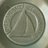 Close-up of maker's mark on green Over and Back yellowware bowl 