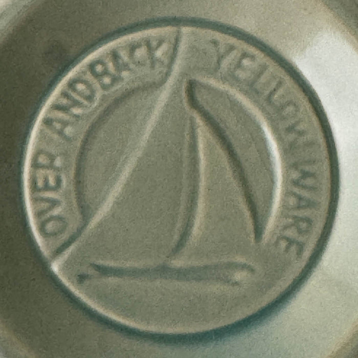 Close-up of maker's mark on green Over and Back yellowware bowl 