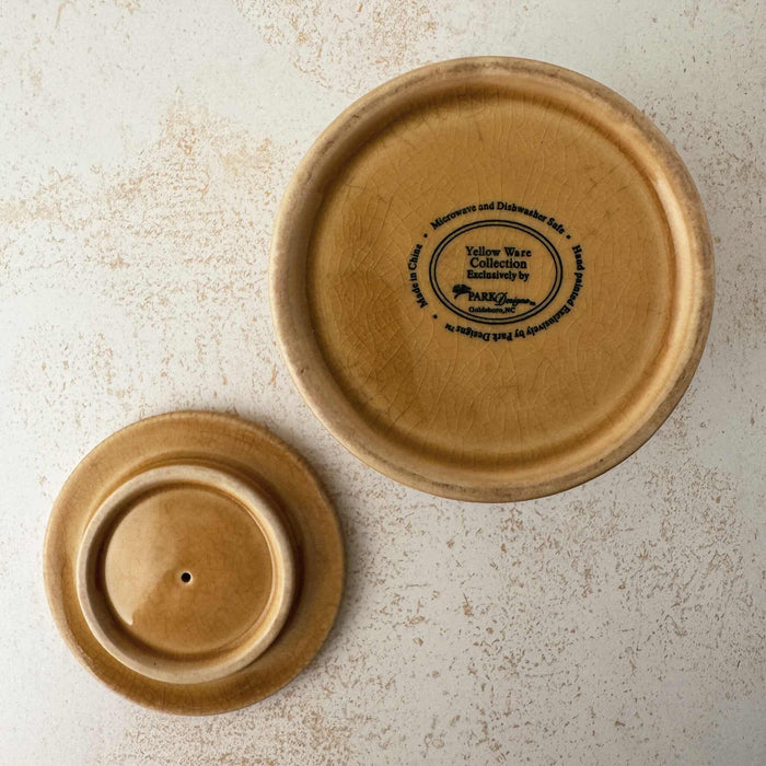 Bottom of canister and lid of Park Designs yellowware canister