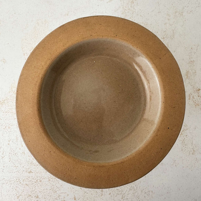 Top down view with lid of vintage lidded stoneware crock with blue bands