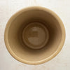 Top down view showing opening and interiorof vintage lidded stoneware crock with blue bands