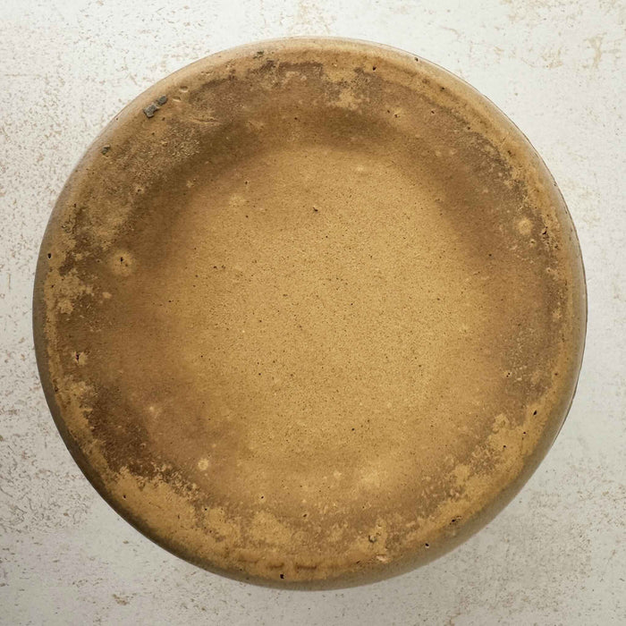 Bottom of vintage lidded stoneware crock with blue bands