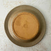 Underside of lid of vintage lidded stoneware crock with blue bands