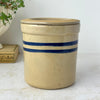 Vintage tan stoneware crock with matching lid and two cobalt blue horizontal stripes