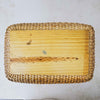 Bottom view of vintage lidded bamboo picnic basket with handles