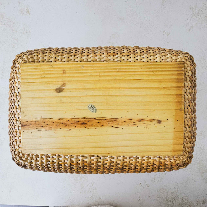 Bottom view of vintage lidded bamboo picnic basket with handles