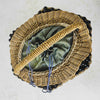 Top down view of antique wicker vanity basket with beaded hexagonal form