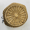 Bottom view of antique wicker vanity basket with beaded hexagonal form