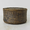 Side view of vintage woven bamboo rice basket