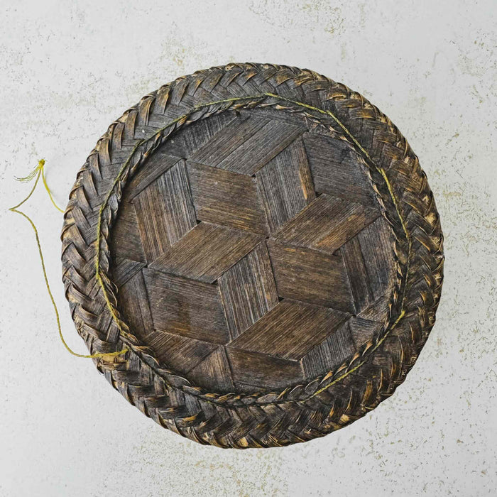 Top down view of vintage woven bamboo rice basket
