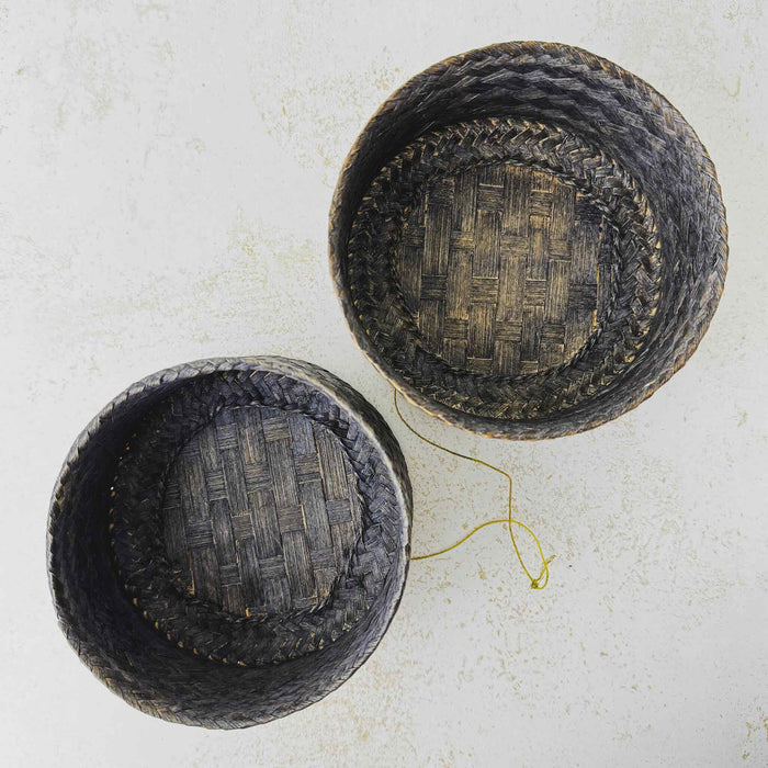 Top down view showing interior of basket and lid of vintage woven bamboo rice basket