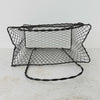 Top down view showing inside of vintage handwired wire basket with twisted handles