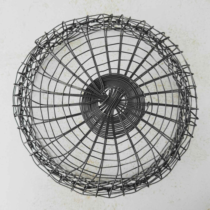 Bottom view of vintage handwired shallow round wire basket