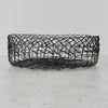Side view of vintage handwired shallow round wire basket