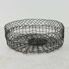Three-quarter view of vintage handwired shallow round wire basket