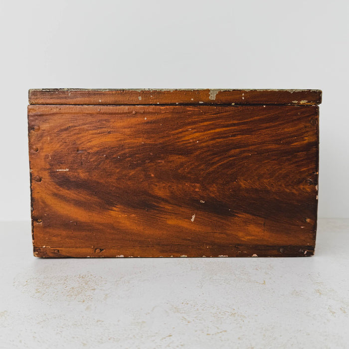Front view of antique primitive storage box with faux grain paint finish