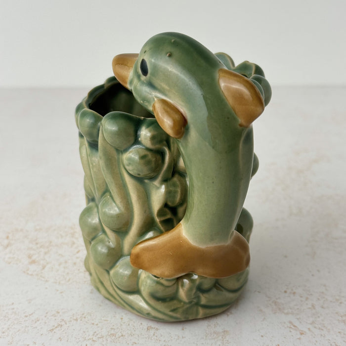 Back of dolphin view on vintage majolica style dolphin cachepot