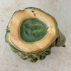 Bottom of vintage majolica style dolphin cachepot