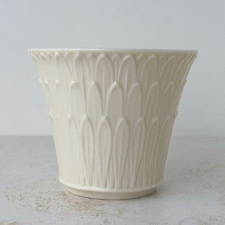 Side profile view of Lenox cachepot with embossed leaf design