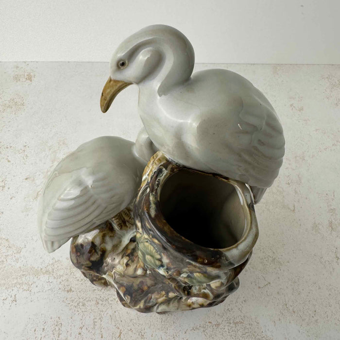 Overhead view of vintage crane figural spill vase showing hollow trunk opening and two white cranes from above