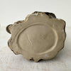 Unglazed base of vintage crane figural spill vase showing incised slash marks