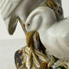 Close-up detail of vntage majolica style crane spill vase
