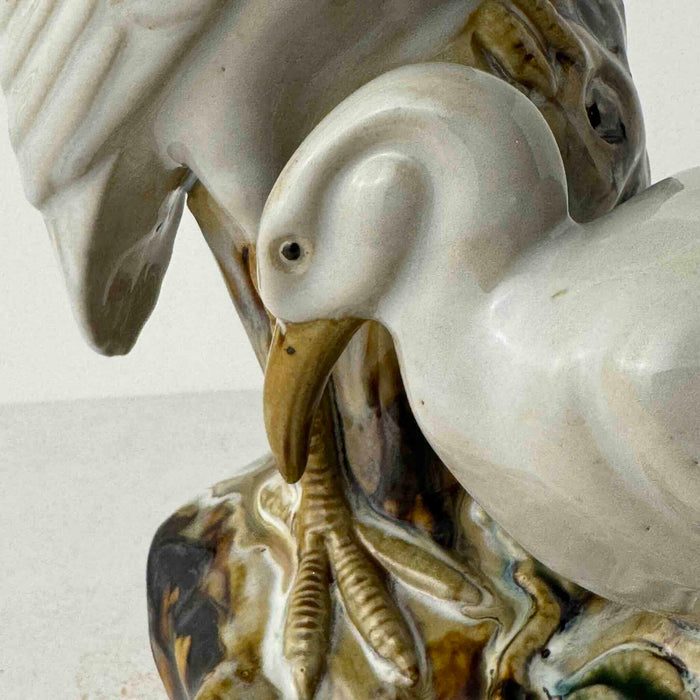 Close-up detail of vntage majolica style crane spill vase