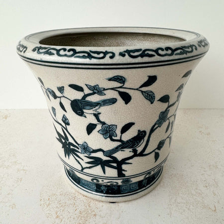 Three-quarter view of Asian-style blue and gray ceramic cachepot