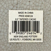 Close-up of label on Asian-style blue and gray ceramic cachepot