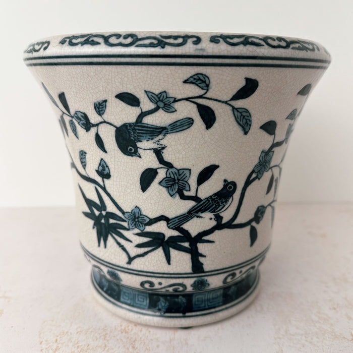 Side view of Asian-style blue and gray ceramic cachepot