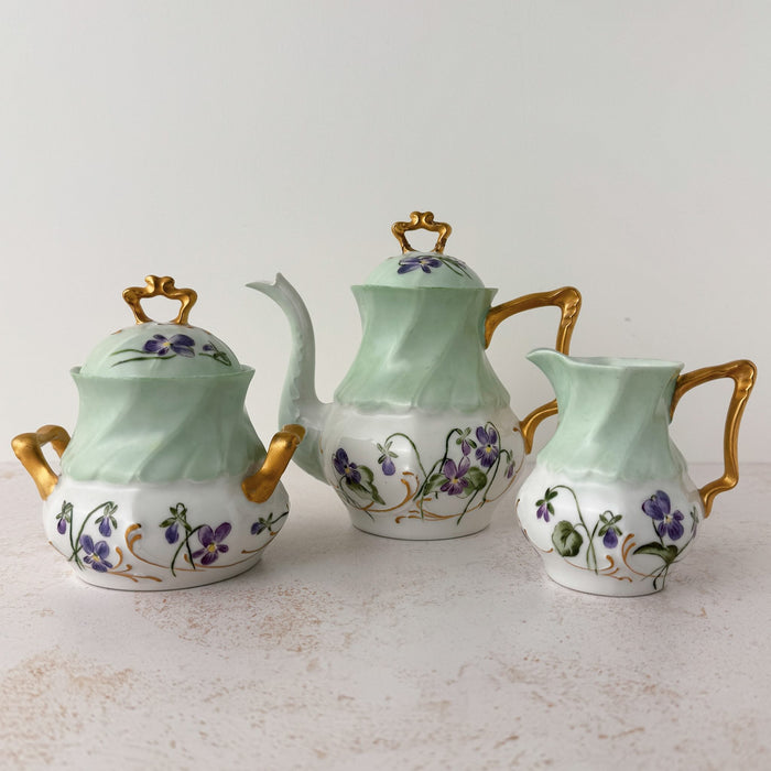 Front view of Jean Pouyat Limoges violets tea set 
