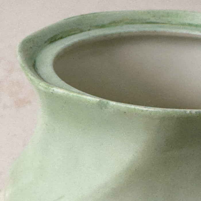 Close-up of small glazed rim manufacturing irregularity on sugar bowl rim