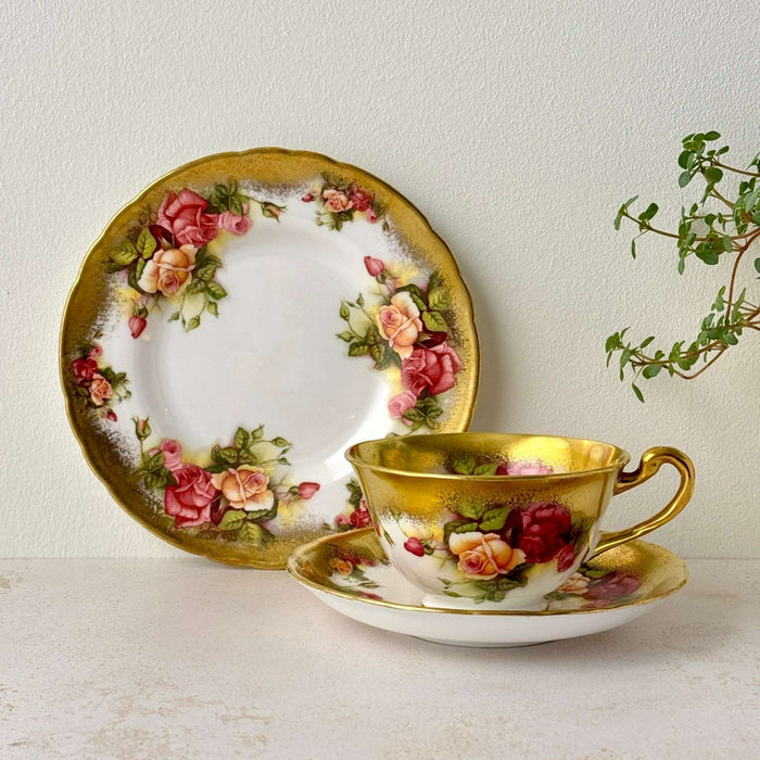 Vintage Royal Chelsea Golden Rose bone china tea trio with teacup, saucer, side plate, rose pattern, and gold trim