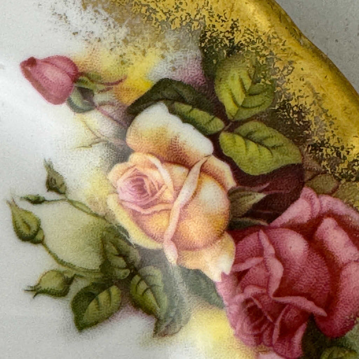 Close-up of roses and gold border on Royal Chelsea Golden Roses side plate