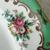 Close-up view of Tuscan Blenheim dessert plate floral decoration and green and gilt border