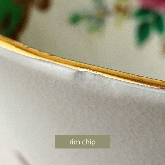 Close-up of Tuscan Blenheim teacup rim showing very small chip and crazing disclosed in condition notes