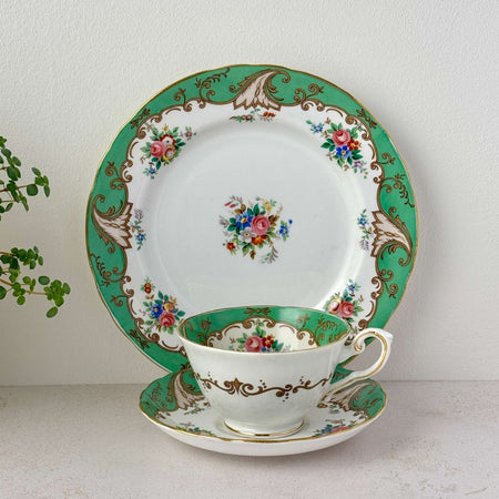 Vintage Tuscan Blenheim bone china tea trio with teacup, saucer, dessert plate, green border, floral pattern, and gold trim