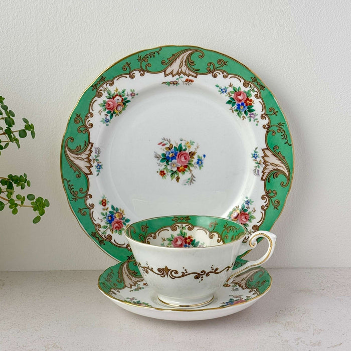 Vintage Tuscan Blenheim bone china tea trio with teacup, saucer, dessert plate, green border, floral pattern, and gold trim