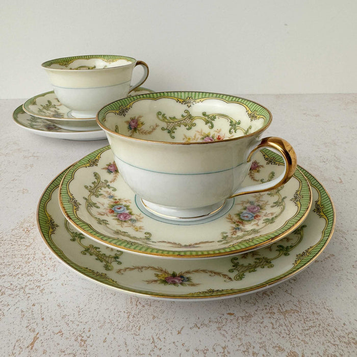 View of two Noritake Marlene Green tea trios with one trio in front of the other
