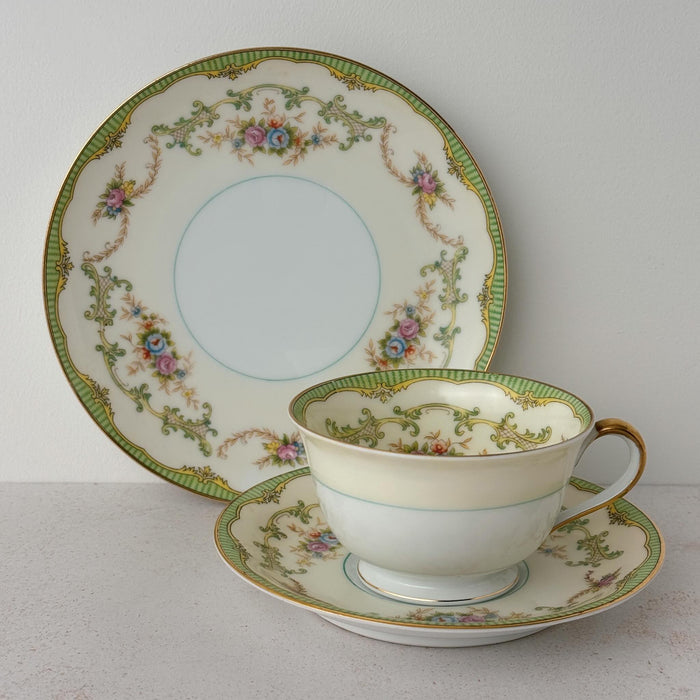 Noritake Marlene Green side plate standing behind matching teacup and saucer