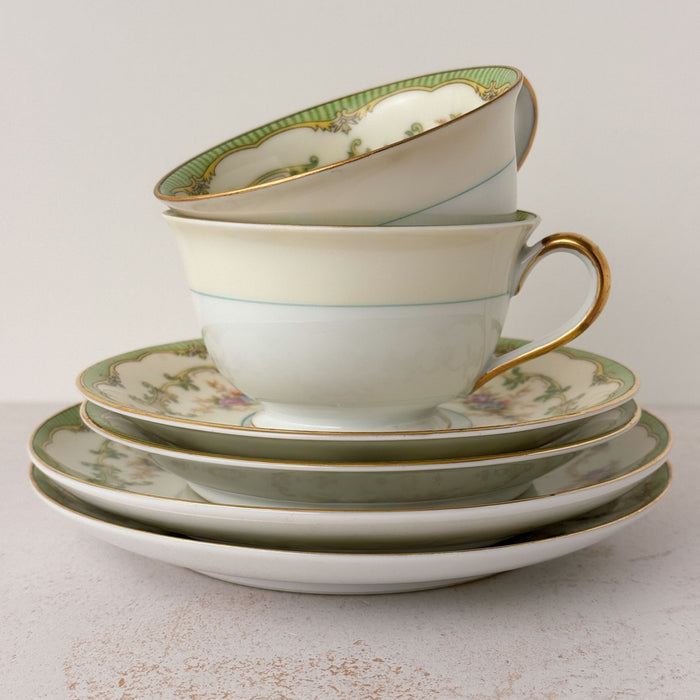 Side view of stacked Noritake Marlene Green tea trios 