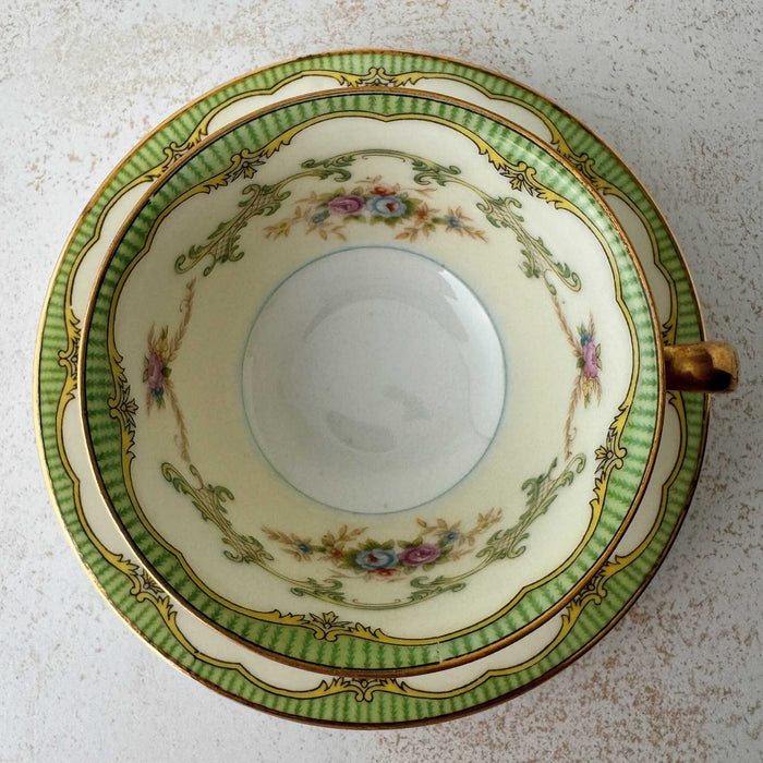 Top down view Noritake Marlene Green teacup stacked on matching saucer