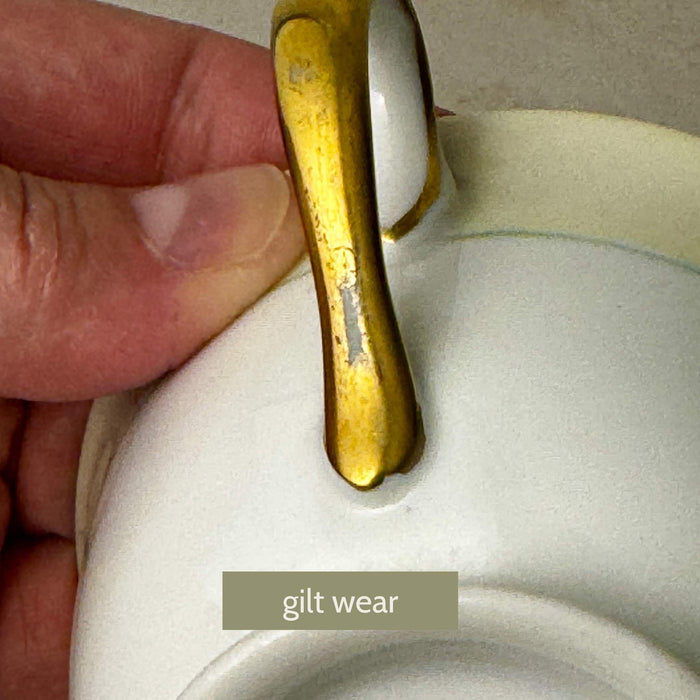 Close-up of first Noritake Marlene Green teacup handle showing light wear to gold trim consistent with vintage age and use
