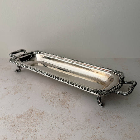 Angled three-quarter view of vintage silverplate rectangular serving tray