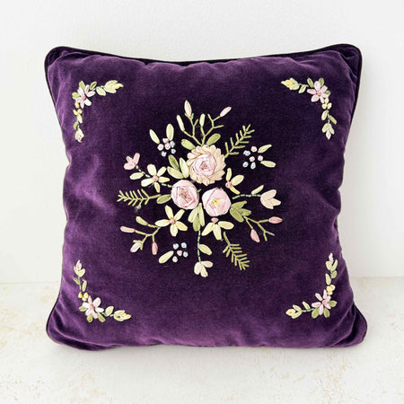 Front view of purple velvet floral ribbon accent pillow