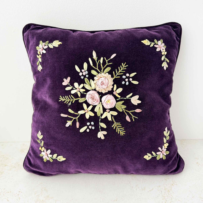 Front view of purple velvet floral ribbon accent pillow