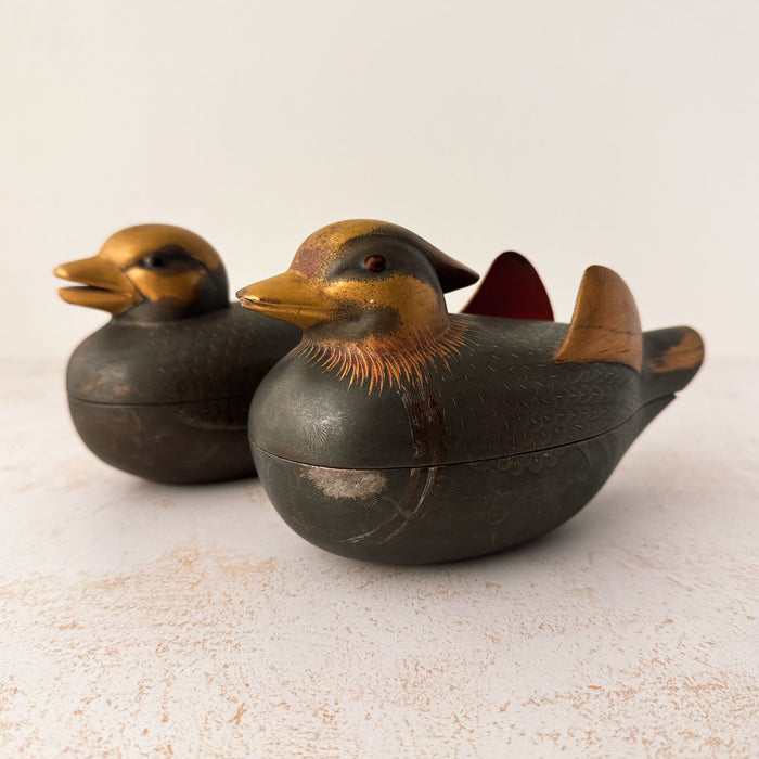 Facing left view of pair of Japanese mandarin duck incense boxes