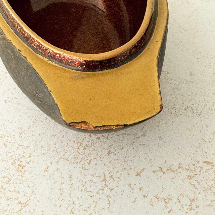 Close-up of chipped tail on female Japanese mandarin duck incense box