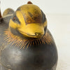 Close-up of chip to bill on male Japanese mandarin duck incense box